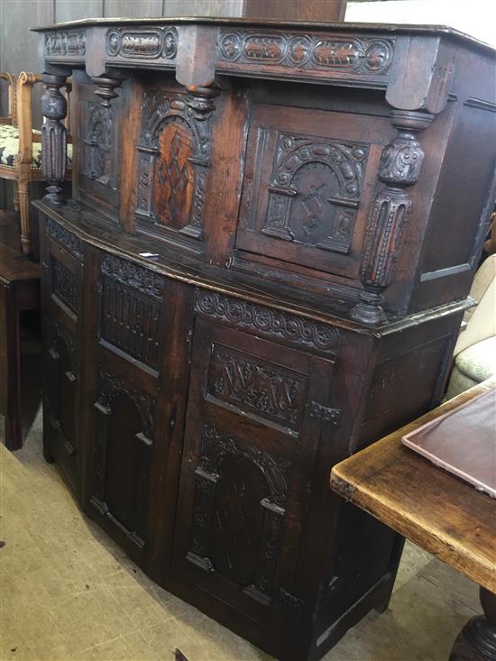 A 17th century style oak court cupboard, W.4ft 8in.